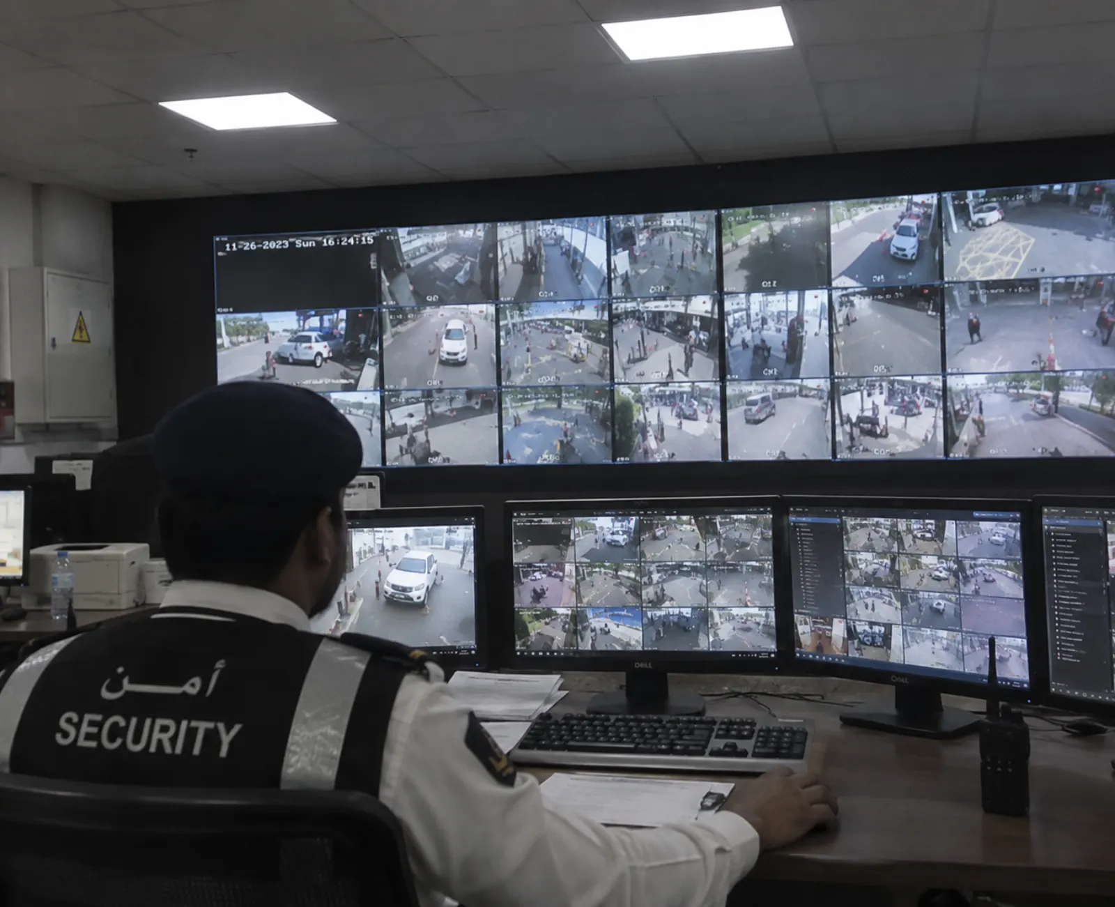 Security officer monitoring CCTV screens in a security control room